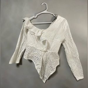 Asymmetrical eyelet top